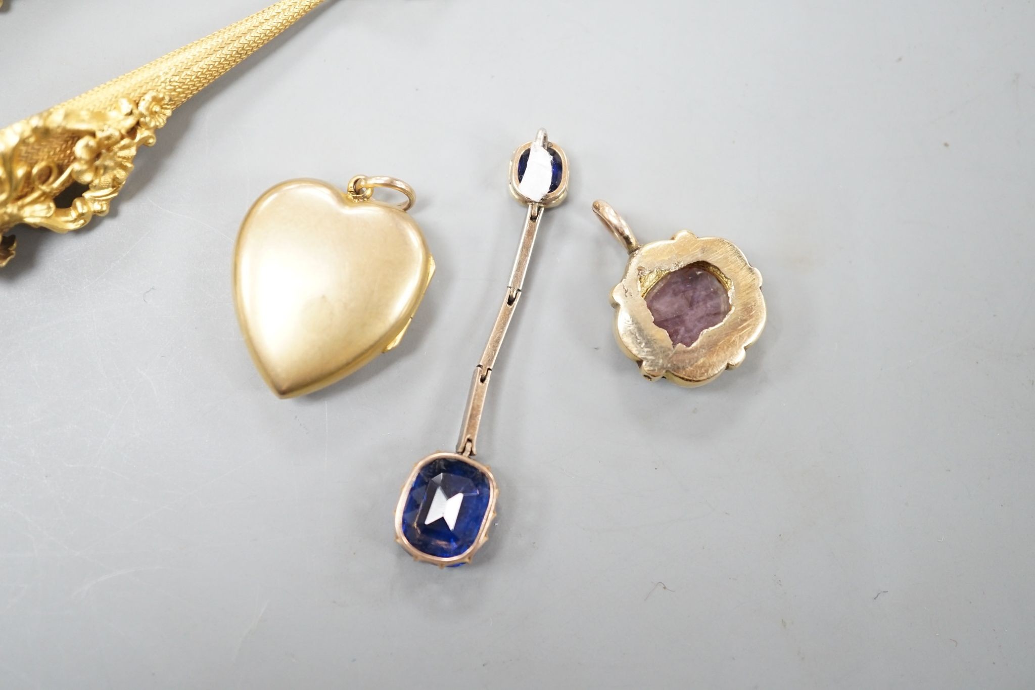 A pair of yellow metal drop earrings, overall 89mm, a simulated sapphire pendant and two other pendants.